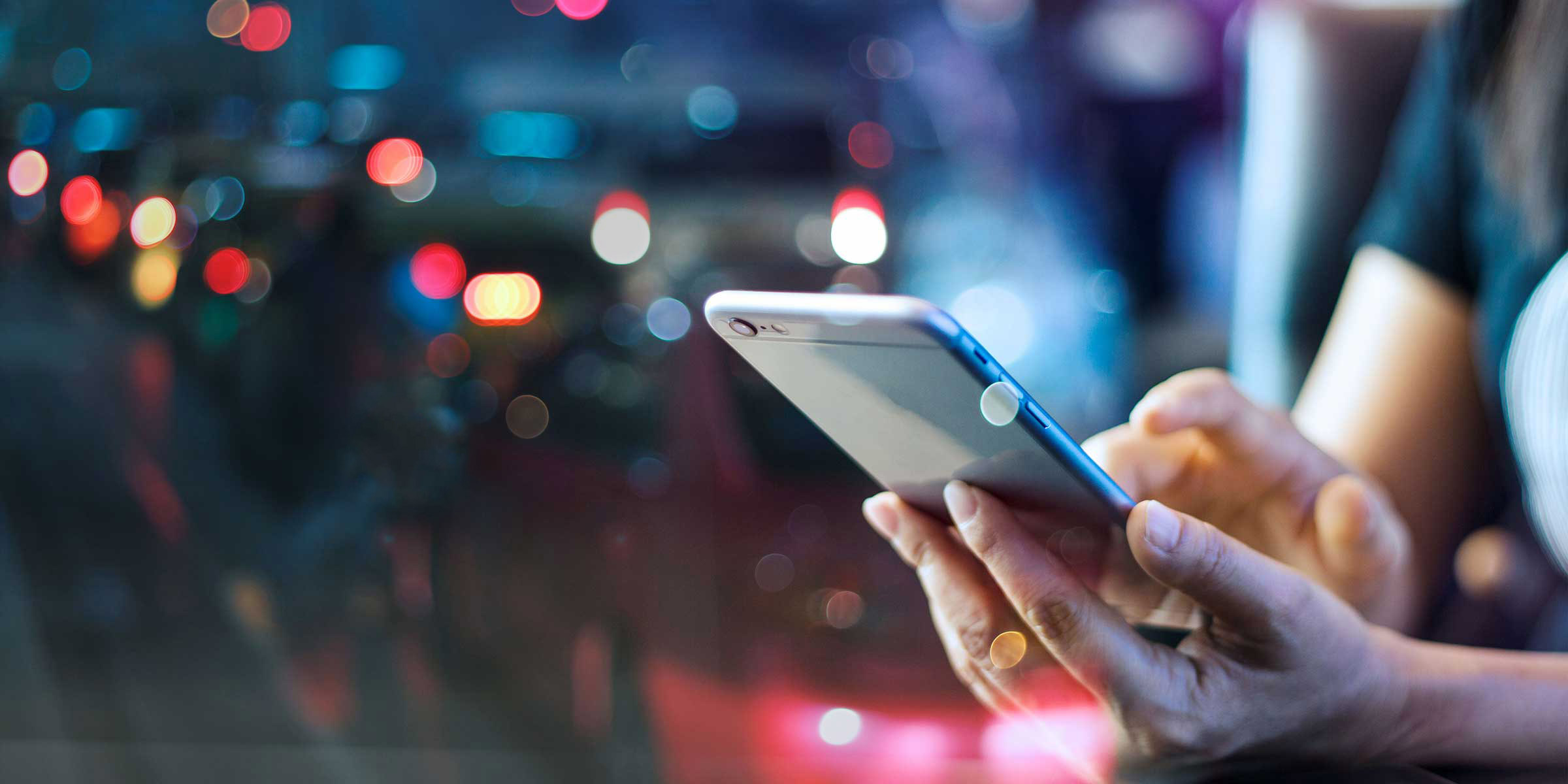 Woman holding mobile phone